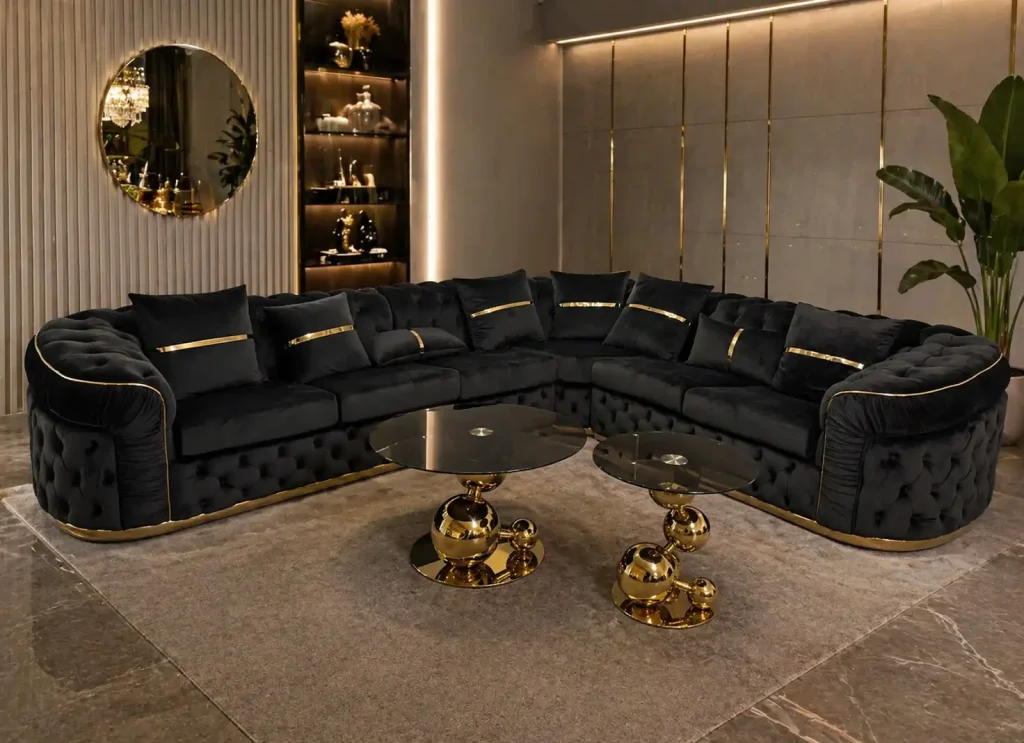 Großes schwarzes Chesterfield Ecksofa mit goldenen Details im Möbelhaus Möbel Plaza Hamburg