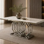 Moderner orientalischer Esstisch in Hamburg mit Marmorplatte und glänzendem Metallgestell im Möbel Plaza Showroom